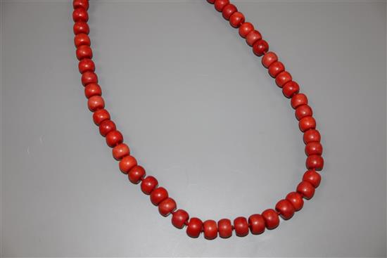 A single strand coral bead necklace, with gilt metal clasp, 47cm, gross weight 64 grams.